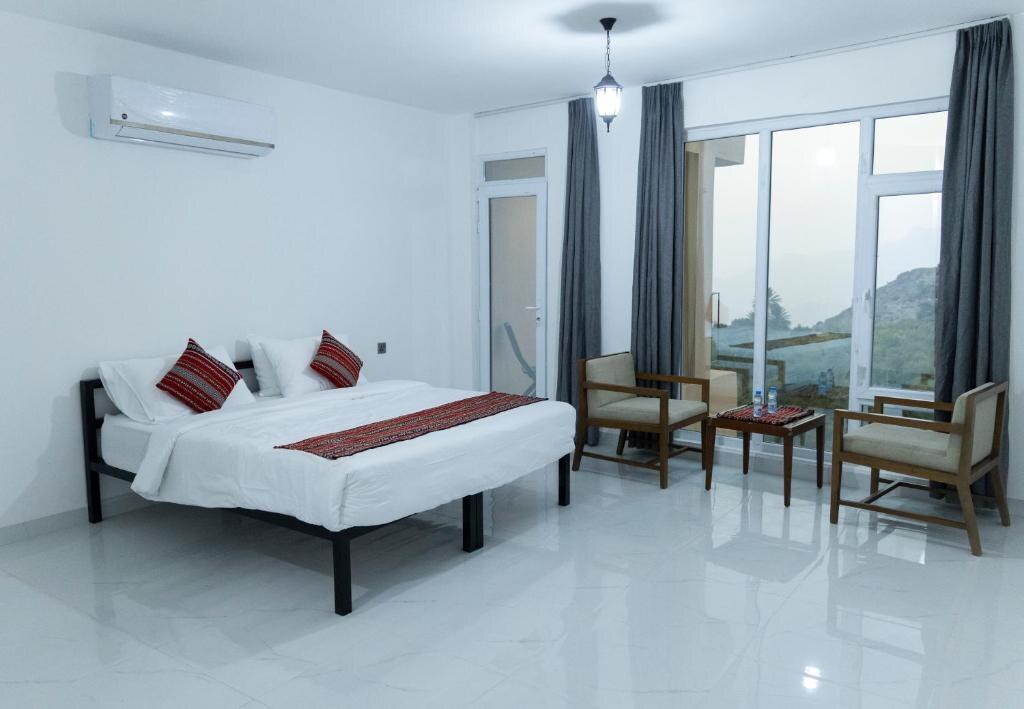 Double guest room with floor-to-ceiling mountain views